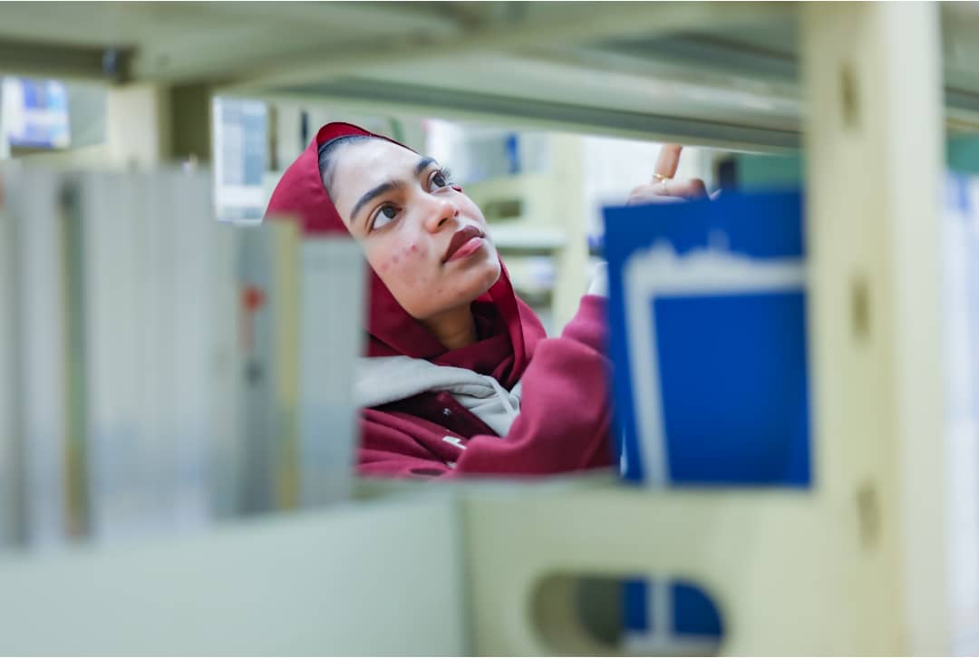 NUAA Student studying in modern university library
